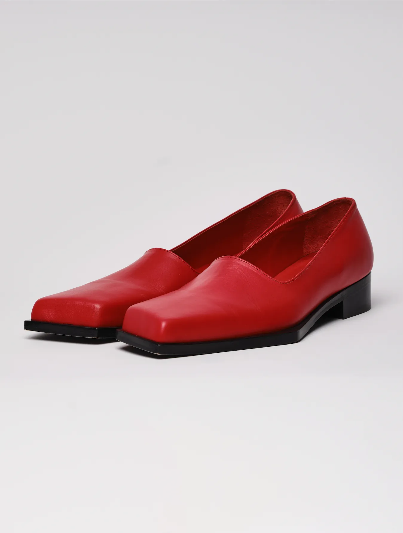 Red slashed loafers