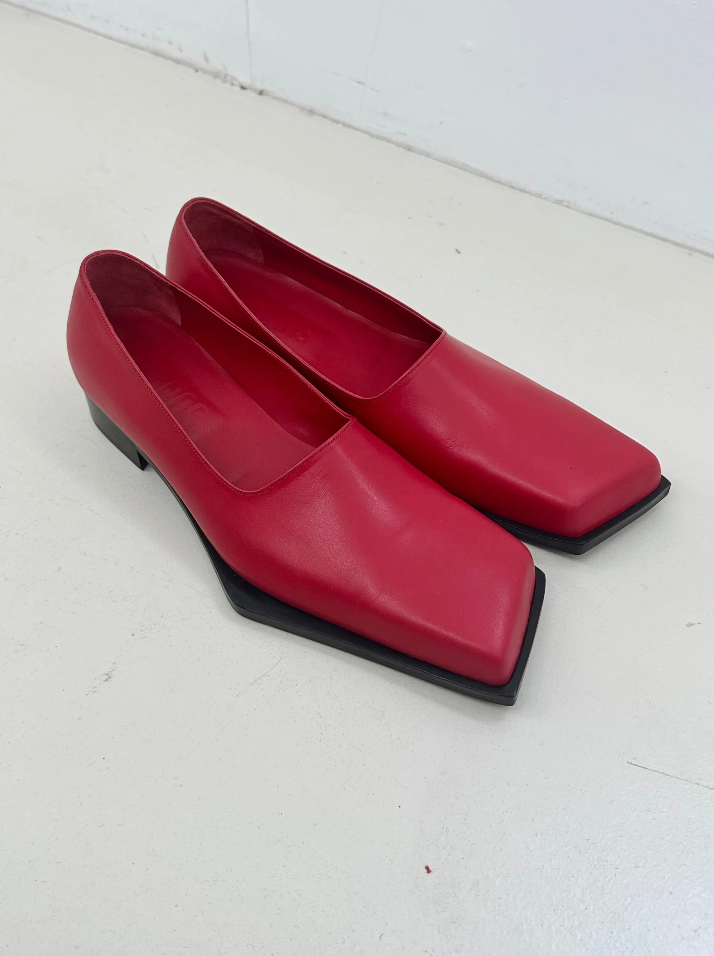 Red slashed loafers