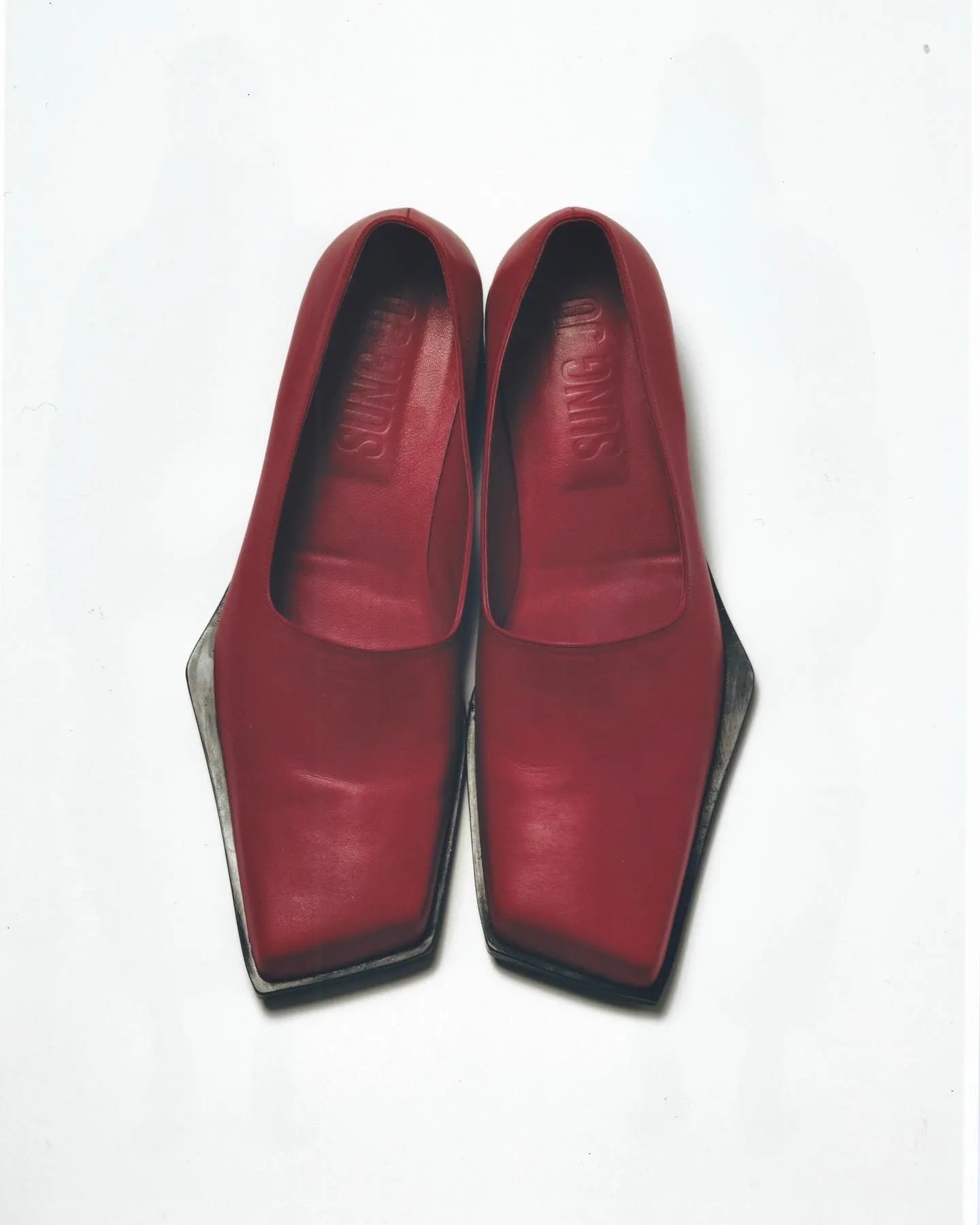Red slashed loafers