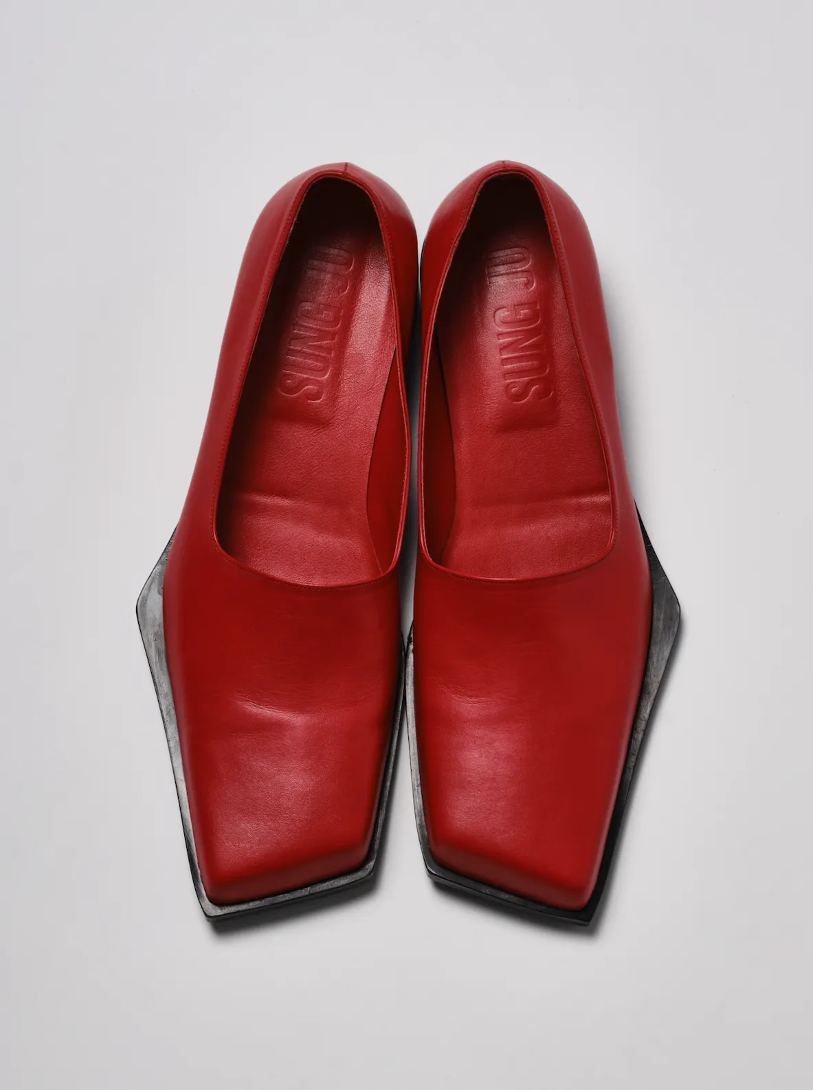 Red slashed loafers