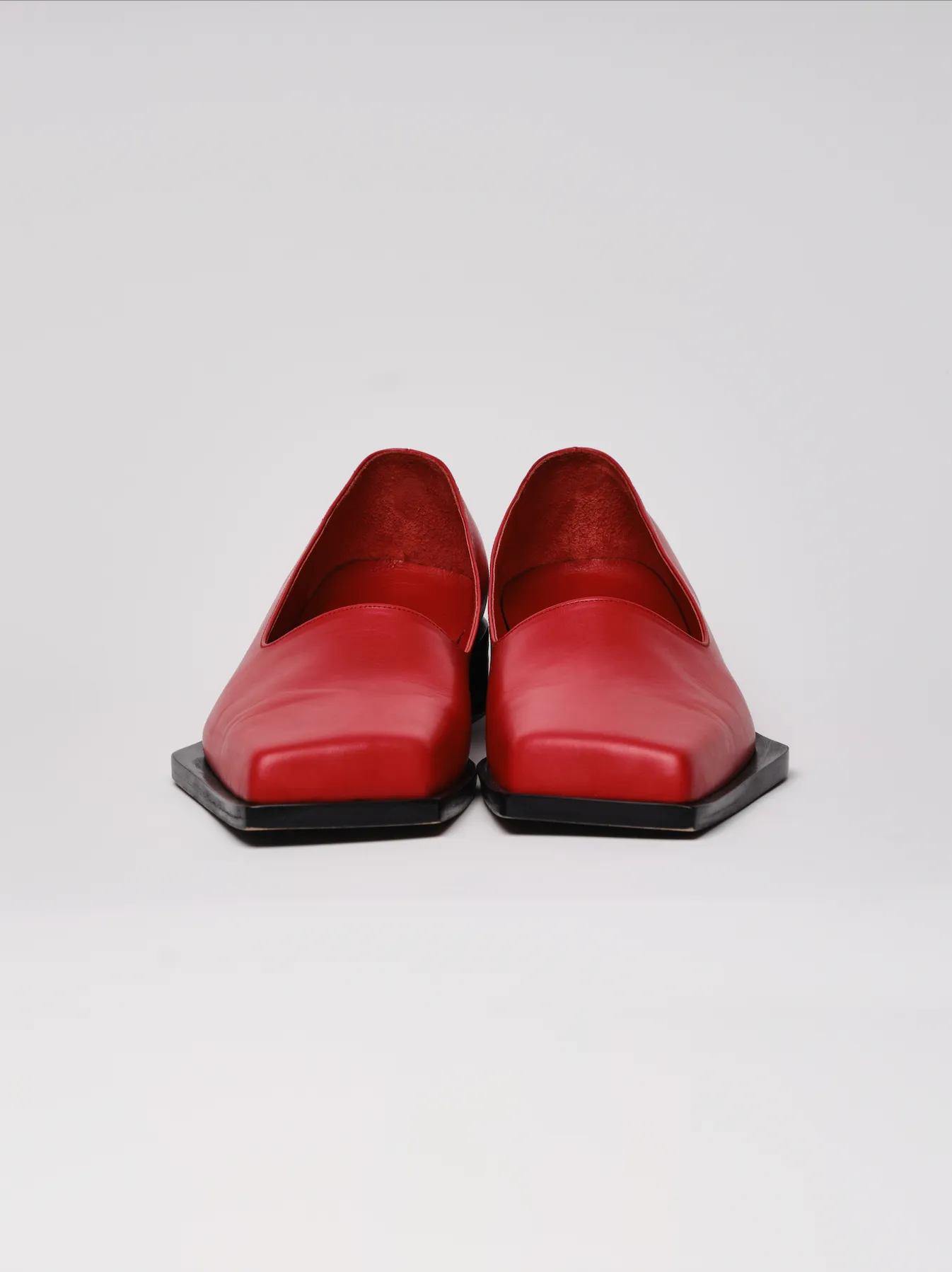 Red slashed loafers